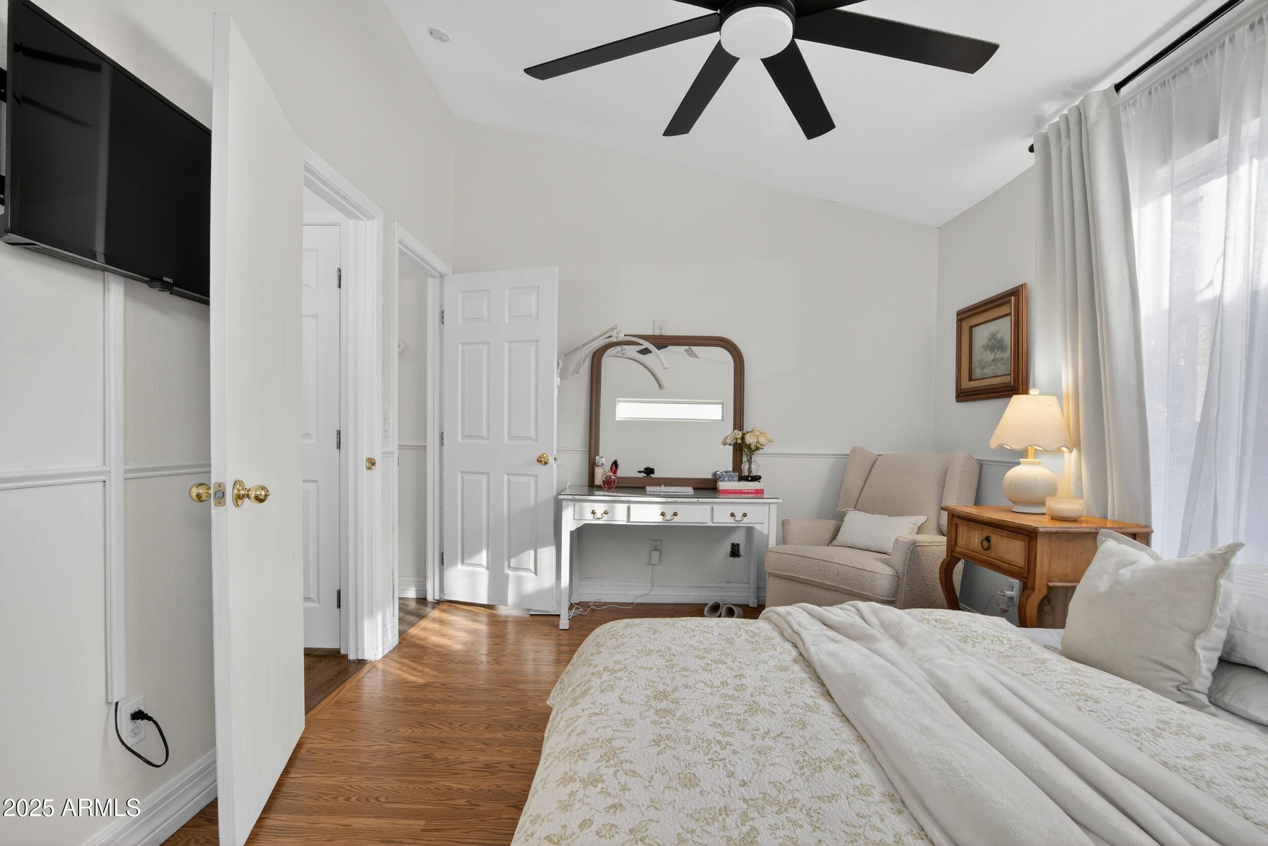 8429 West Coronado Road Phoenix, AZ 85037 - Photo 20 of 37 a living room with furniture and a flat screen tv