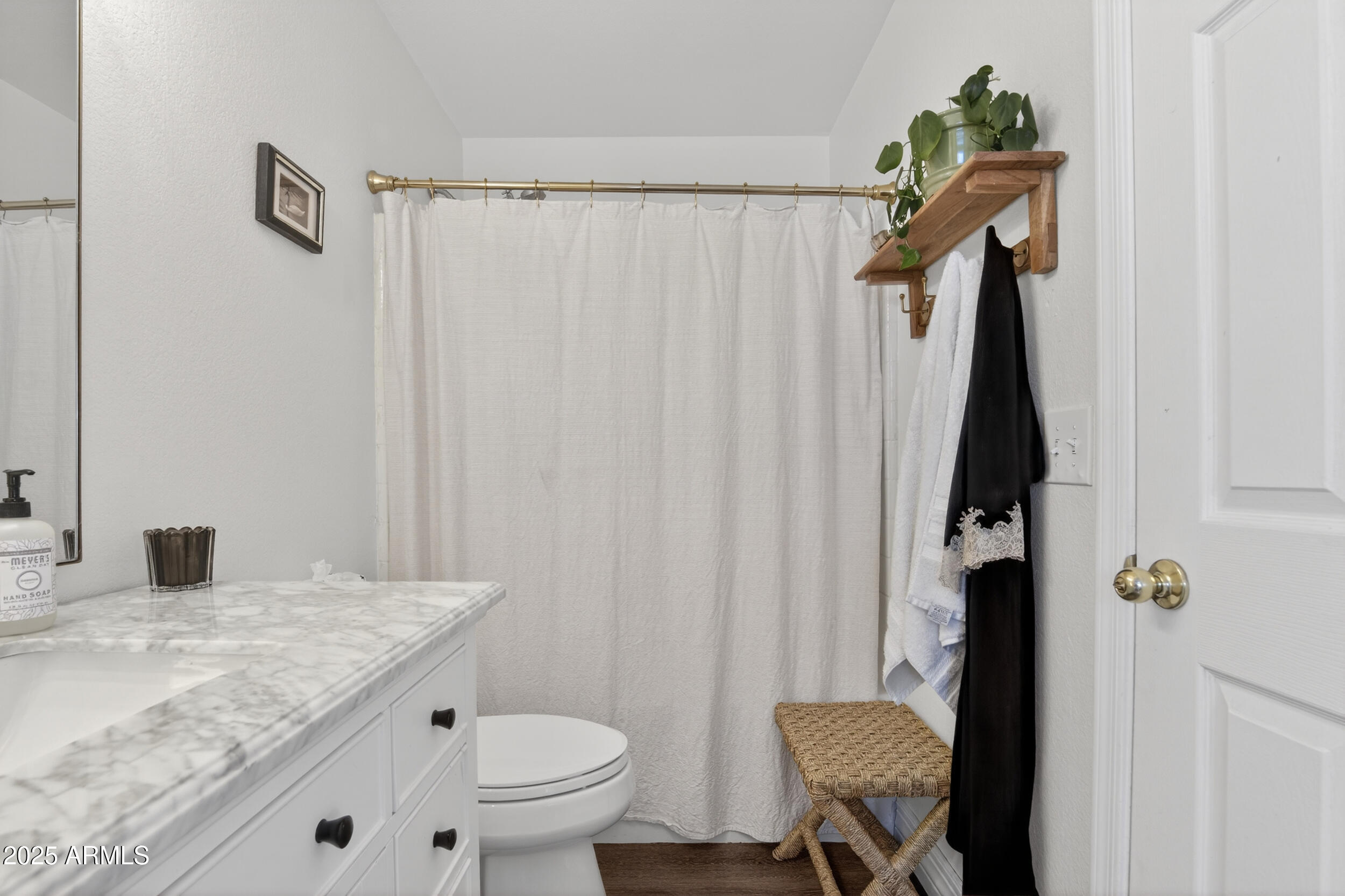 8429 West Coronado Road Phoenix, AZ 85037 - Photo 23 of 37 a bathroom with a granite countertop sink toilet and a mirror