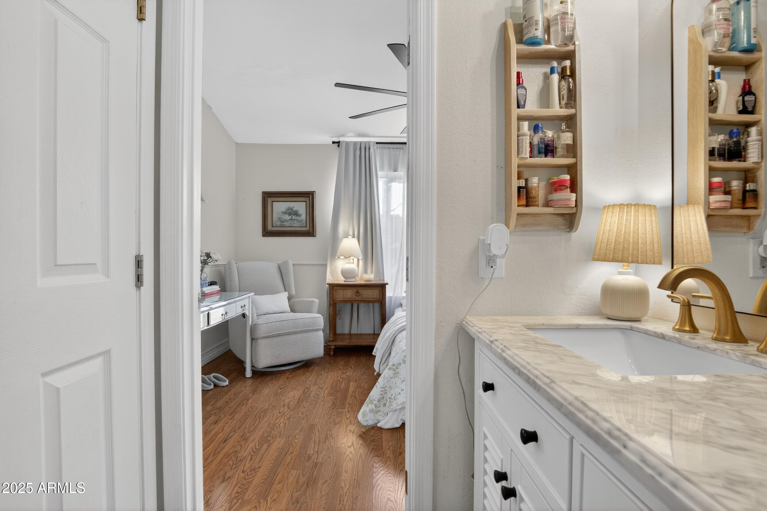 8429 West Coronado Road Phoenix, AZ 85037 - Photo 26 of 37 a en suite bathroom with a granite countertop sink