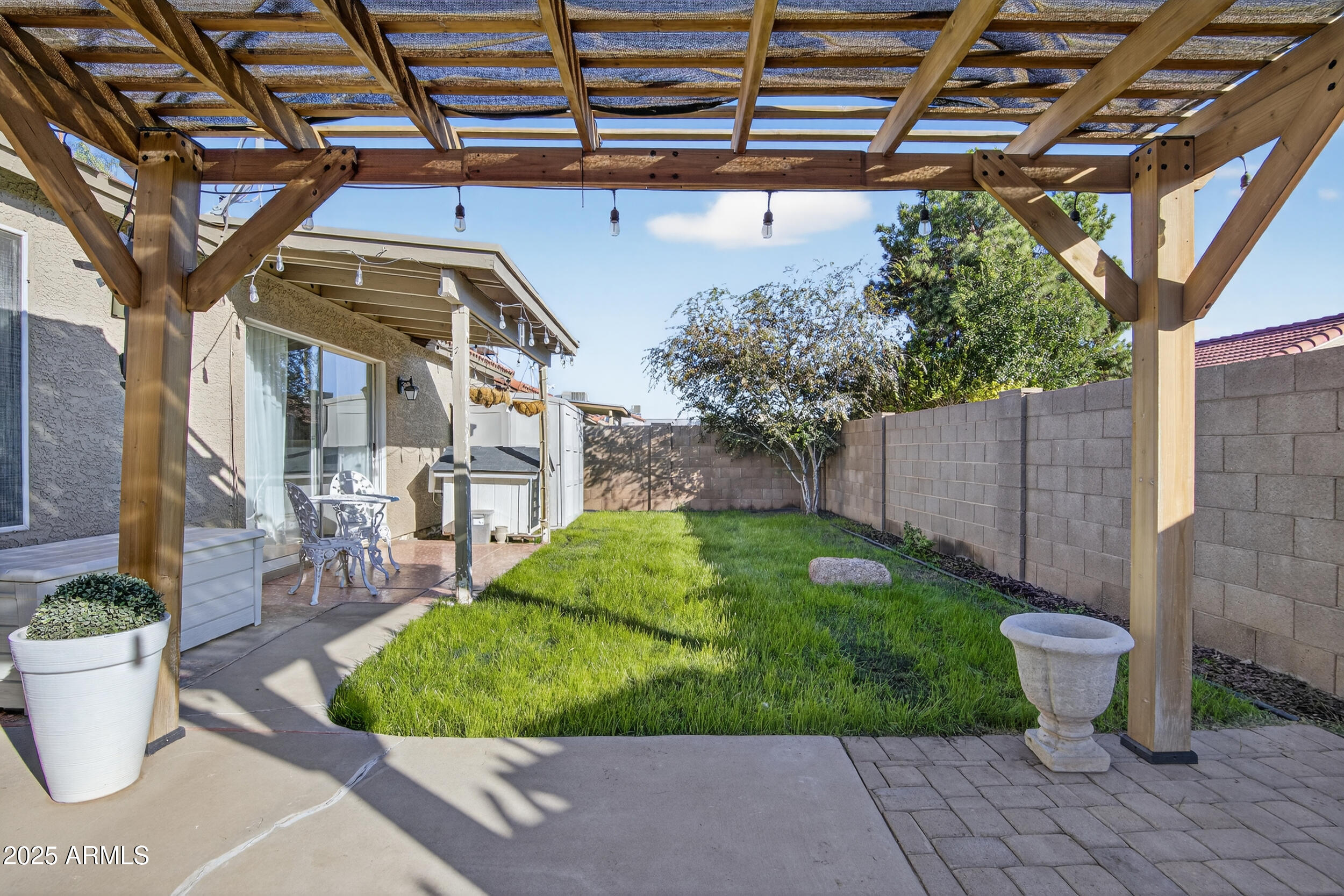 8429 West Coronado Road Phoenix, AZ 85037 - Photo 35 of 37 a view of a backyard with sitting area