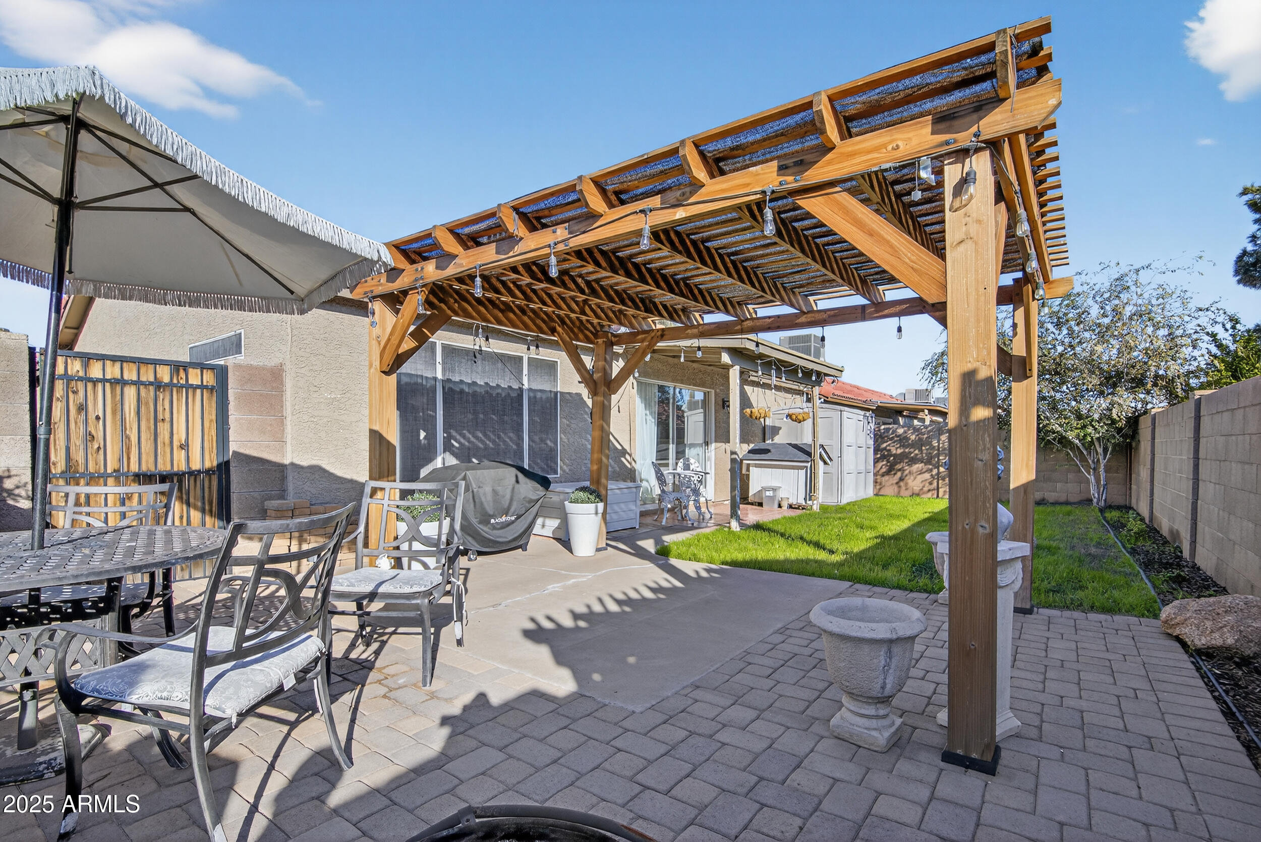 8429 West Coronado Road Phoenix, AZ 85037 - Photo 36 of 37 front view of a house with a patio