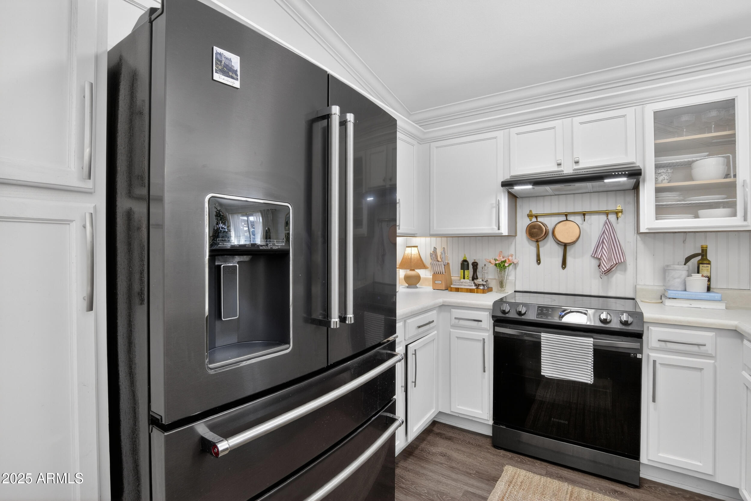 8429 West Coronado Road Phoenix, AZ 85037 - Photo 8 of 37 a kitchen with stainless steel appliances granite countertop a stove and a refrigerator