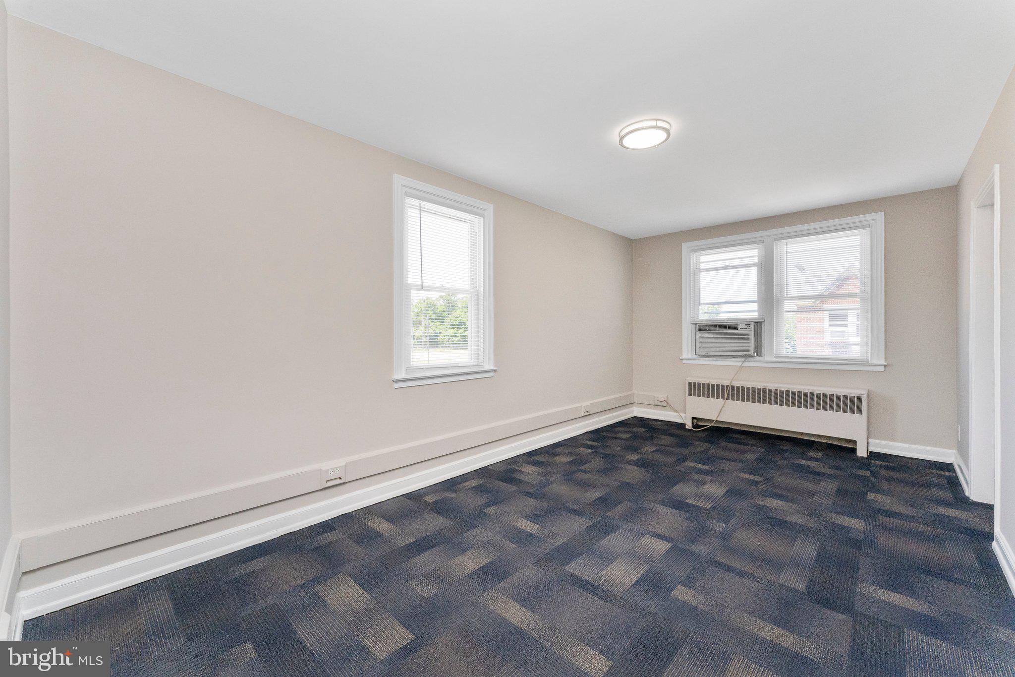 5346 Chew Avenue, Unit 2B Philadelphia, PA 19138 - Photo 6 of 18 an empty room with windows