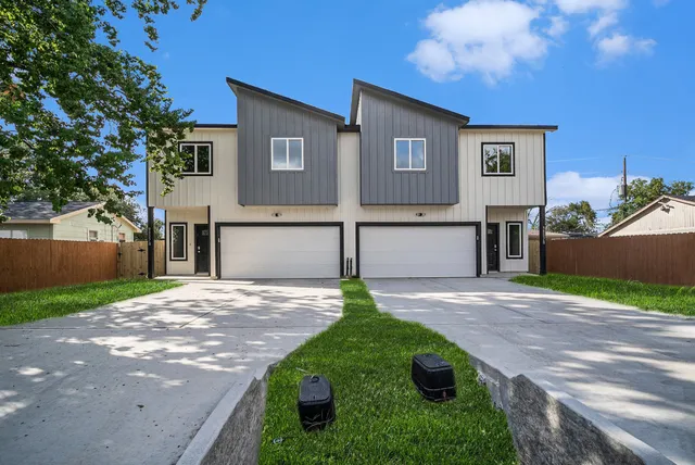 a backyard of a house with yard and garage