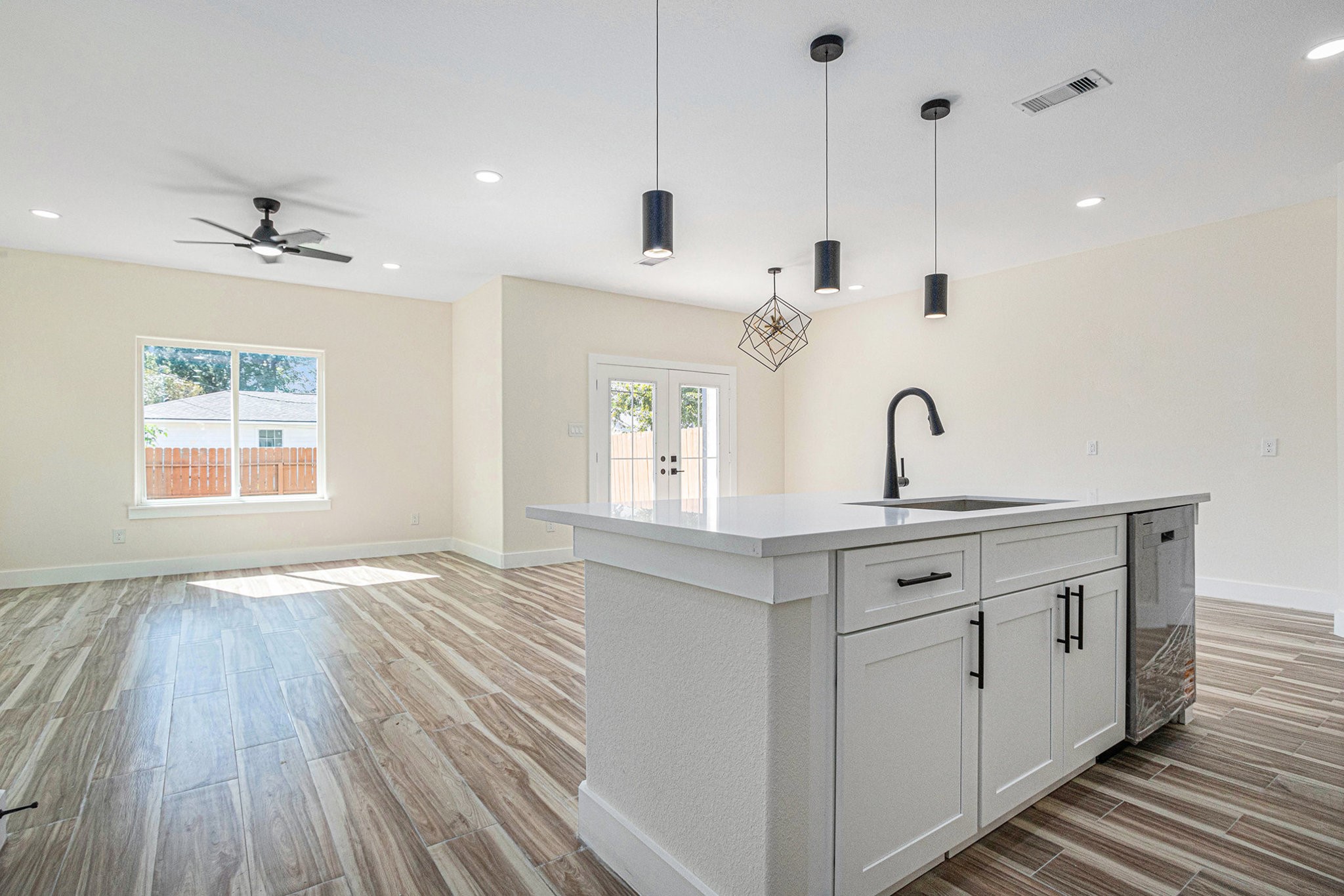 9807 Bamboo Road Houston, TX 77041 - Photo 12 of 37 a view of a kitchen with wooden floor and windows