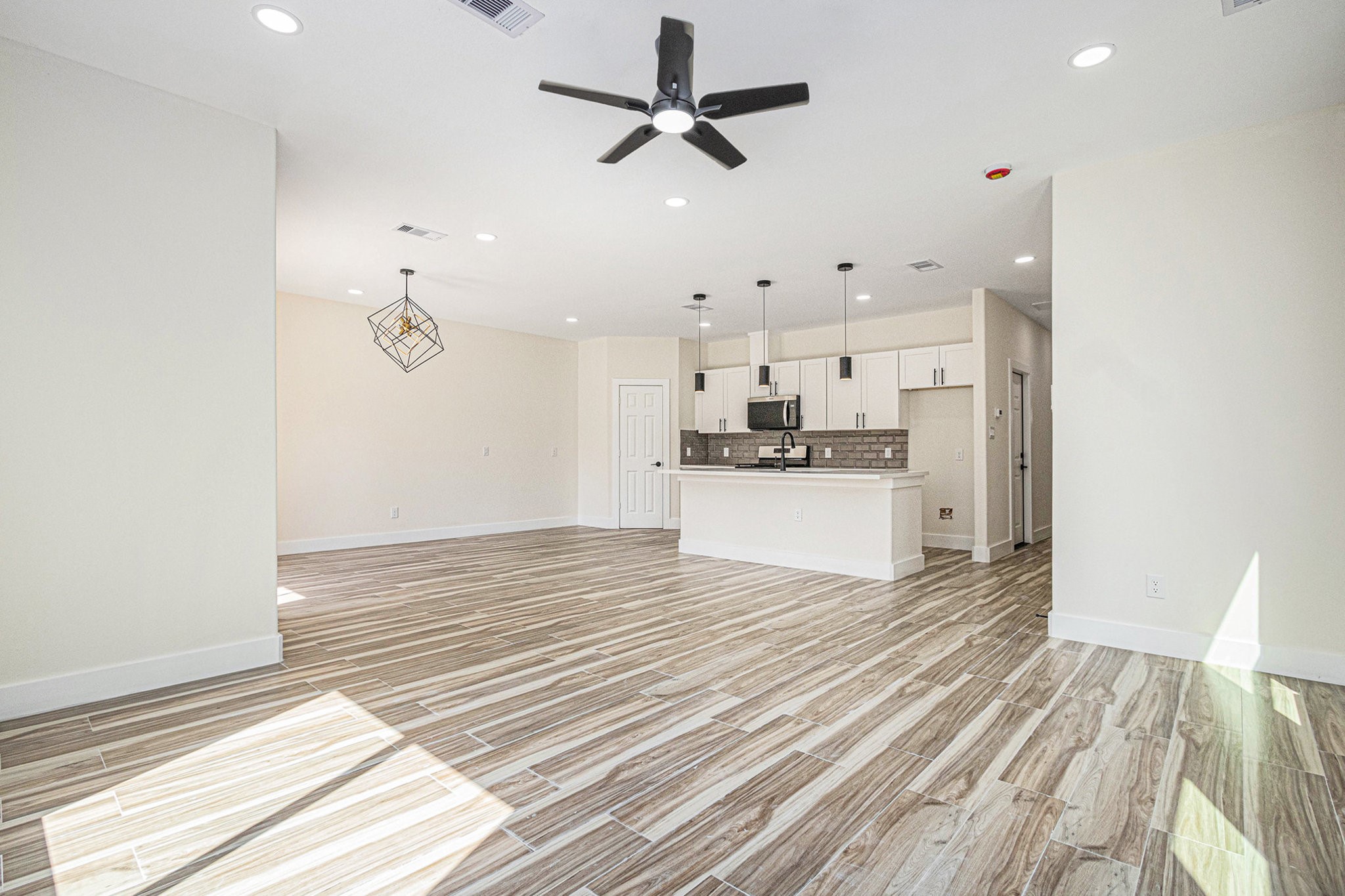 9807 Bamboo Road Houston, TX 77041 - Photo 14 of 37 a view of a kitchen with a stove cabinets and wooden floor