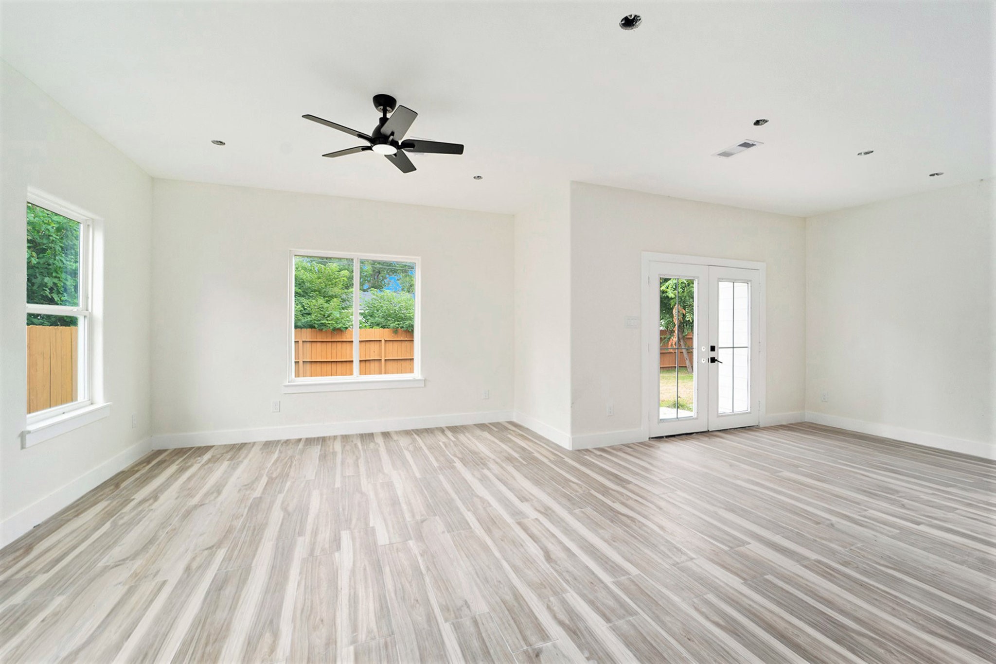 9807 Bamboo Road Houston, TX 77041 - Photo 21 of 37 wooden floor in an empty room with a window