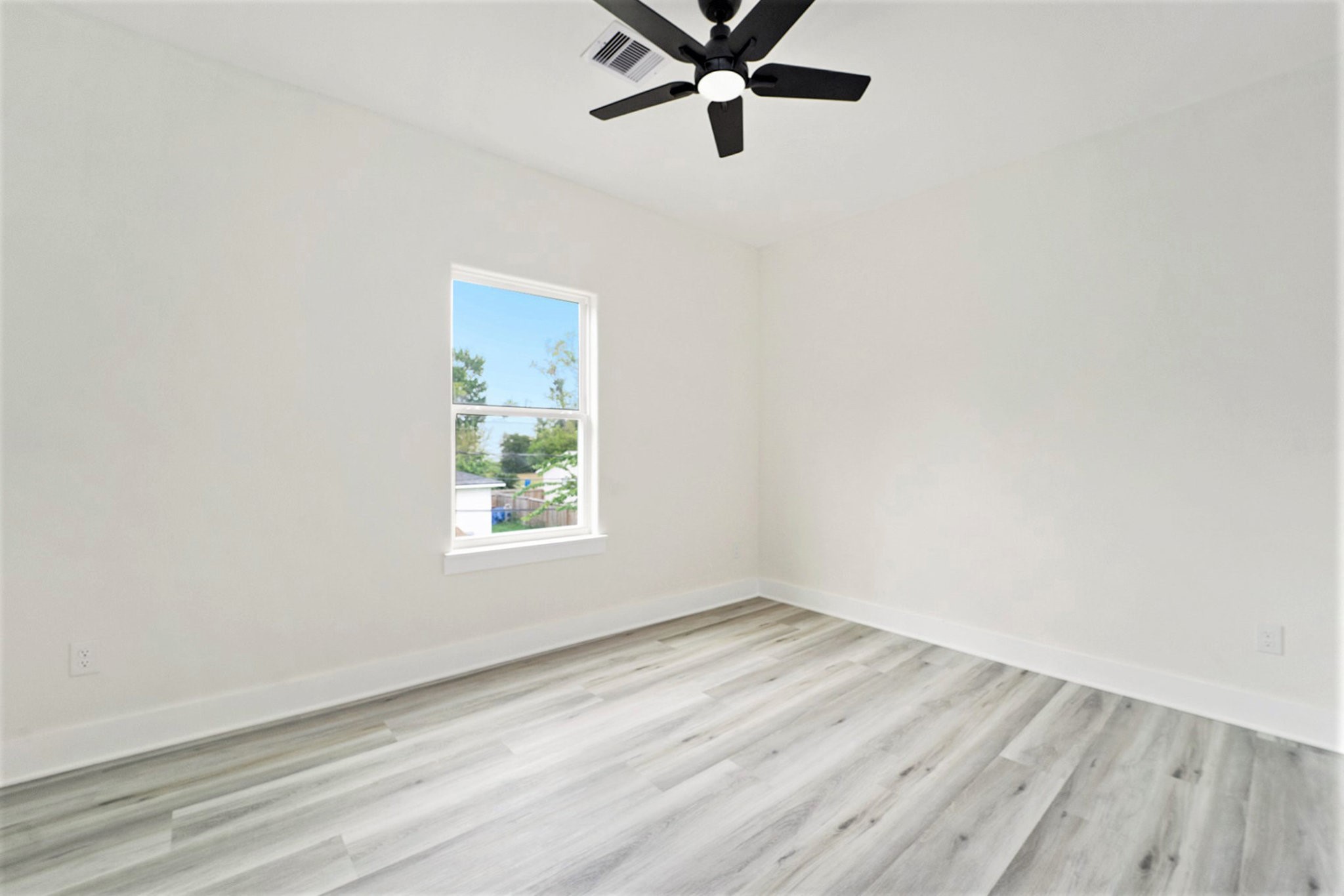 9807 Bamboo Road Houston, TX 77041 - Photo 22 of 37 a view of a room with wooden floor and window