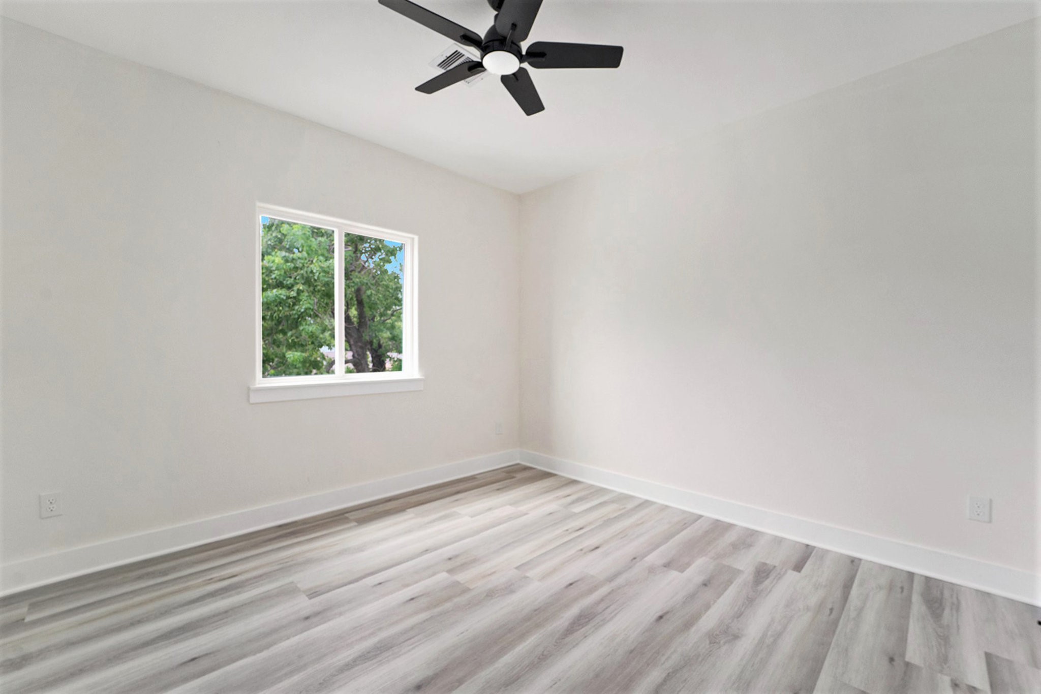 9807 Bamboo Road Houston, TX 77041 - Photo 23 of 37 wooden floor in an empty room with a window