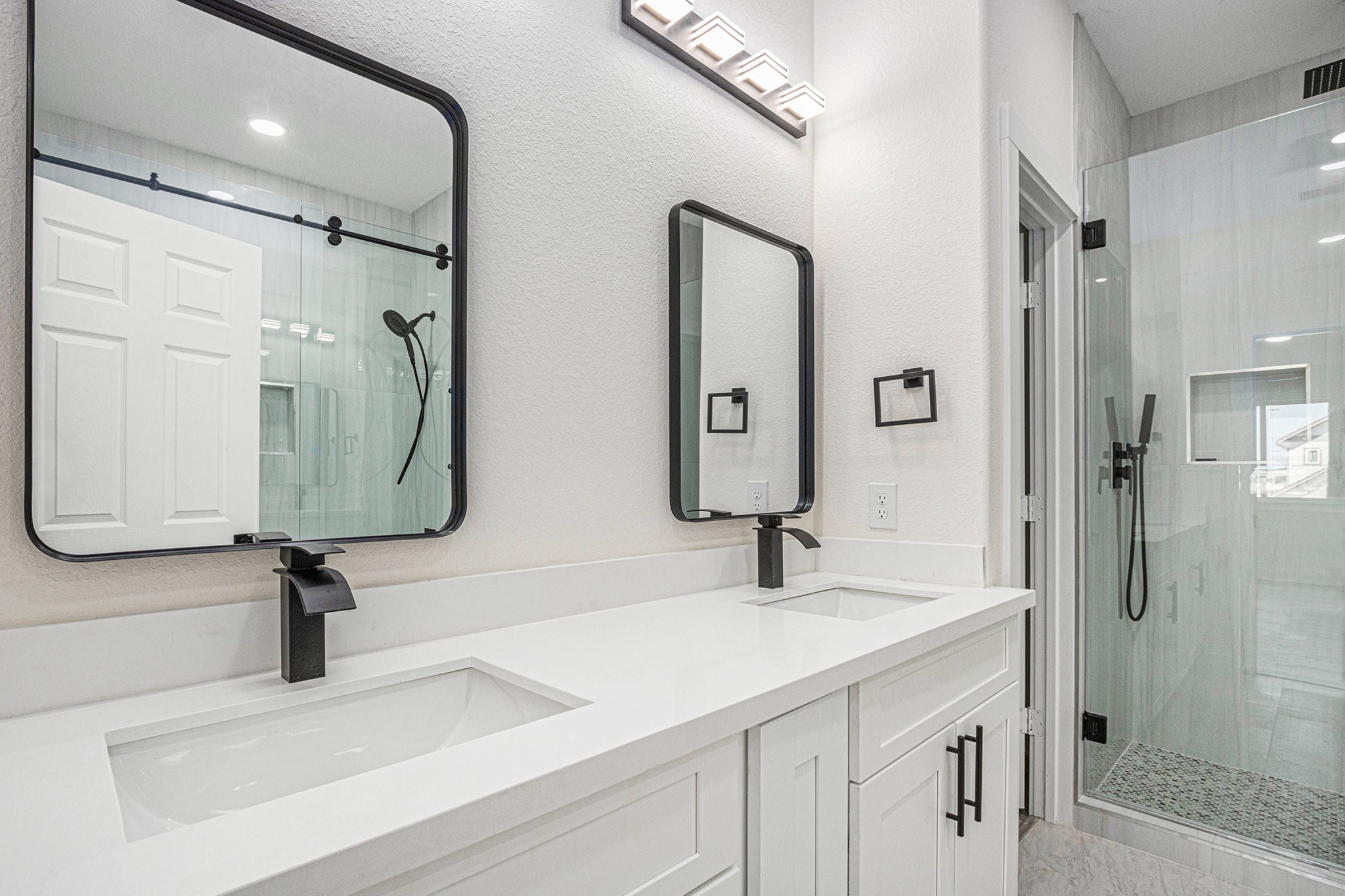9807 Bamboo Road Houston, TX 77041 - Photo 31 of 37 a bathroom with a sink and a mirror