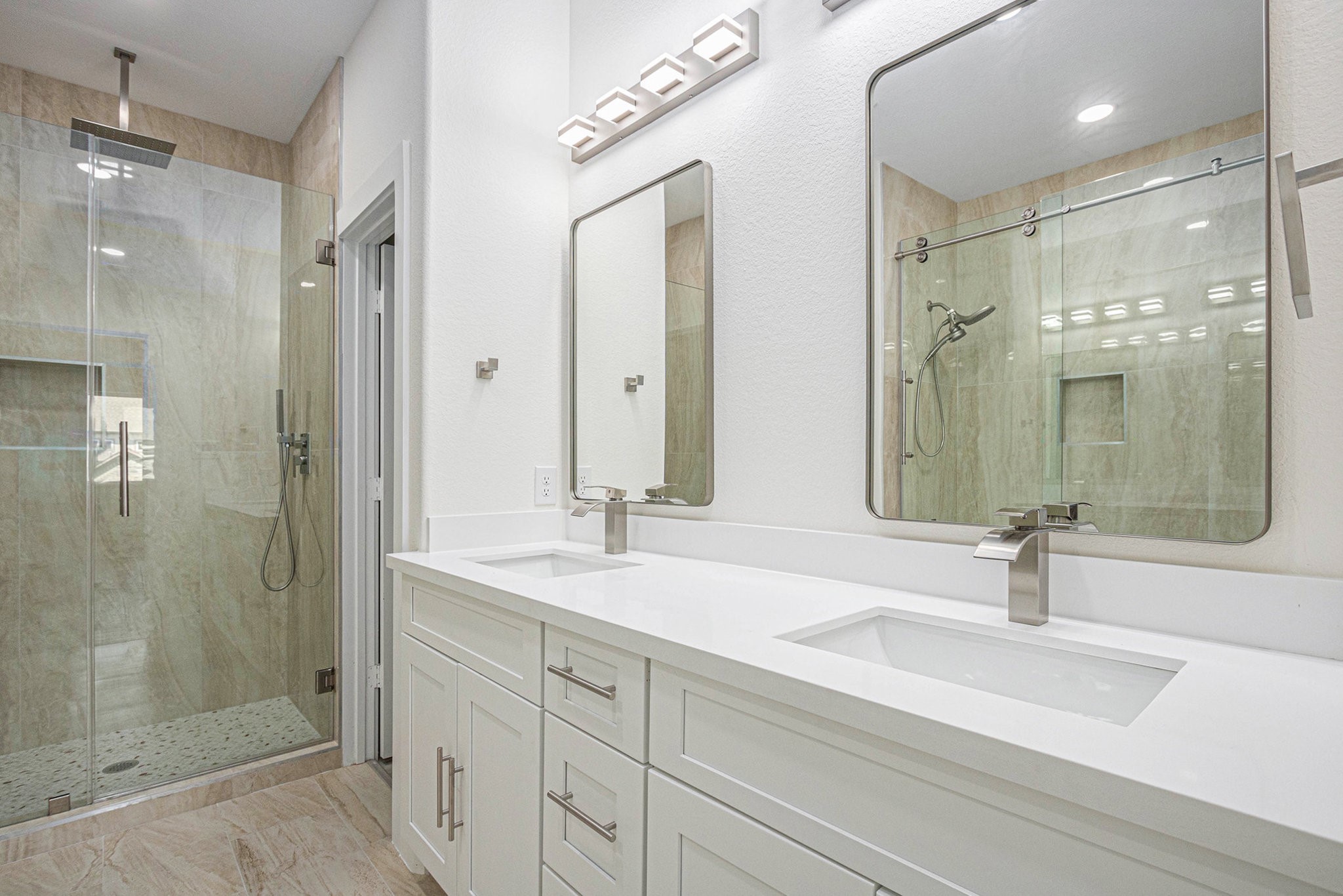 9807 Bamboo Road Houston, TX 77041 - Photo 32 of 37 a bathroom with a sink shower and a mirror
