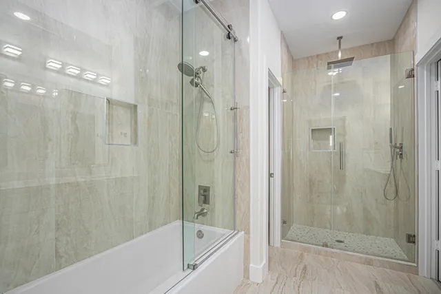 an aerial view of a house with a yard basket ball court and outdoor seating