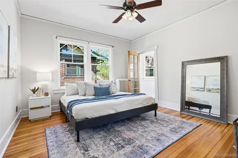 a bedroom with a large bed and a window