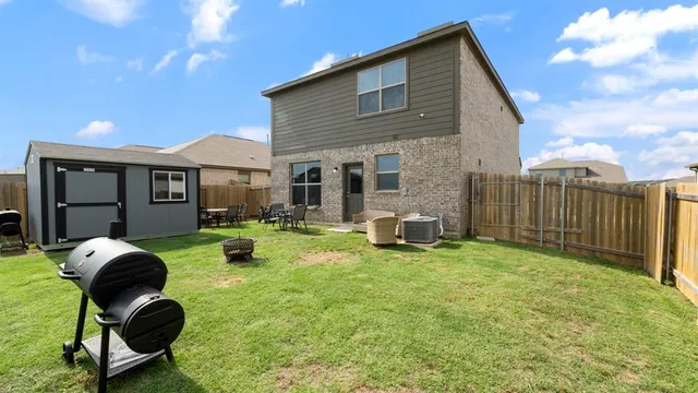 a backyard of a house with seating space