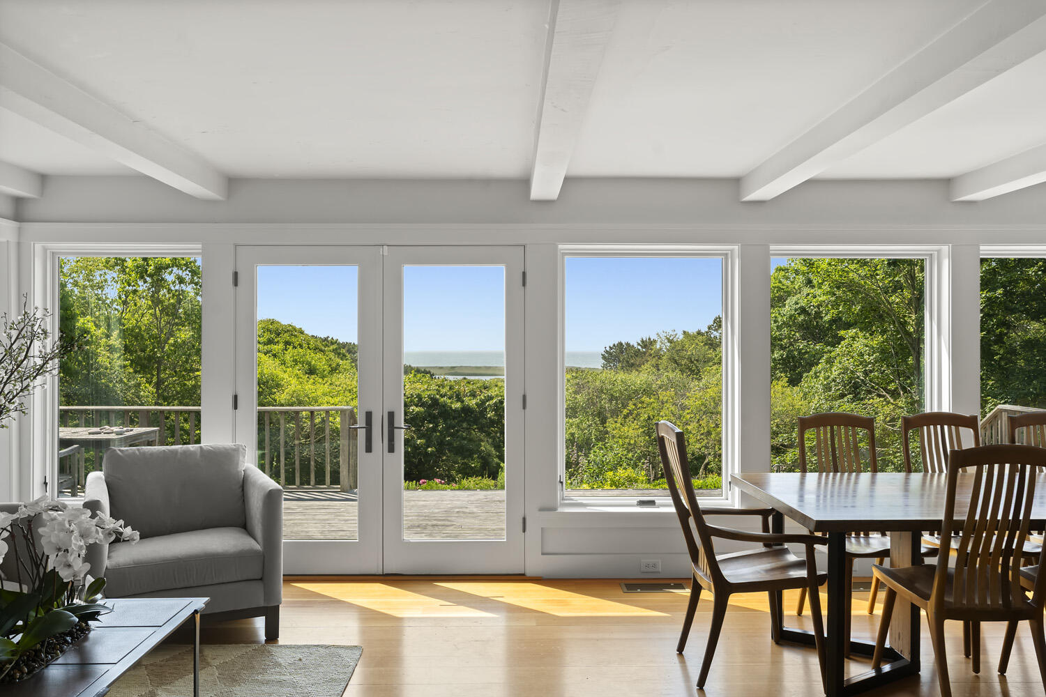 308 S Road Chilmark, MA 02535 - Photo 11 of 41 a dining room with furniture a rug and a large window
