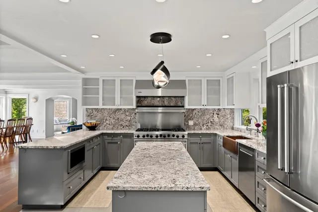 a stove top oven sitting inside of a kitchen