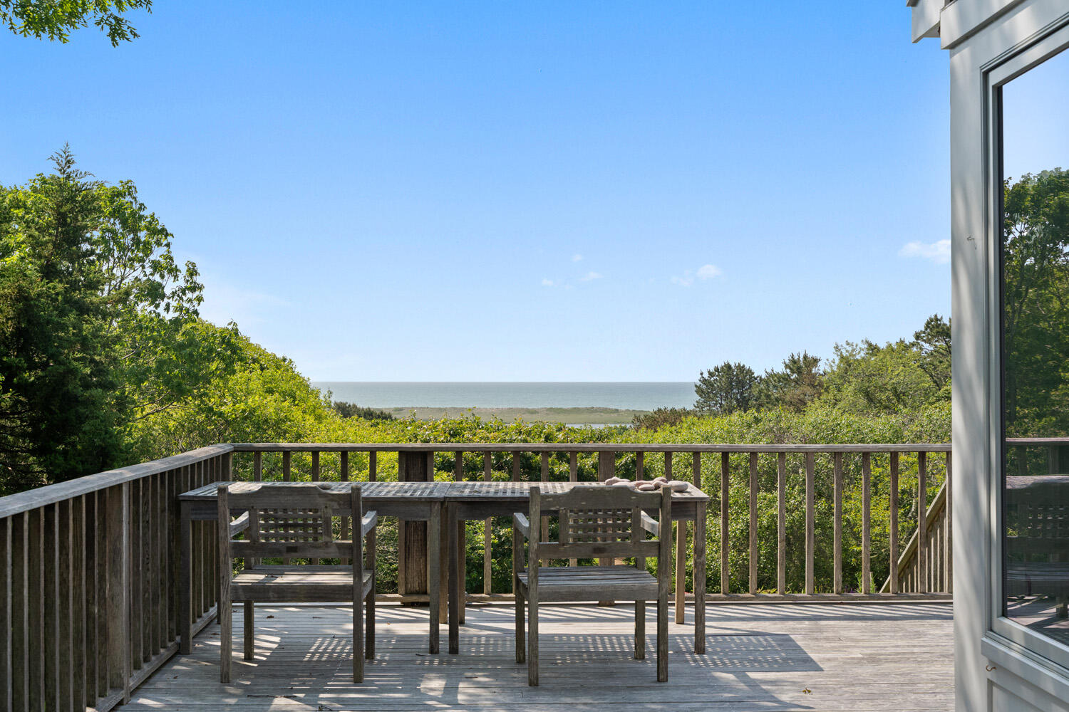 308 S Road Chilmark, MA 02535 - Photo 17 of 41 a view of a chairs and table on the terrace