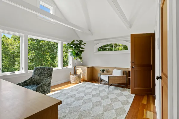 a bedroom with two beds and a window