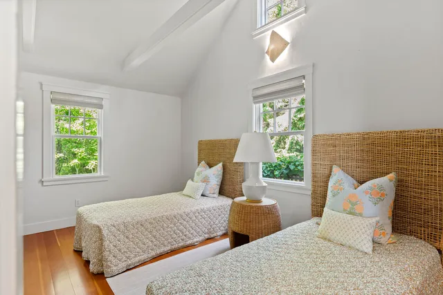 a bedroom with furniture and a window