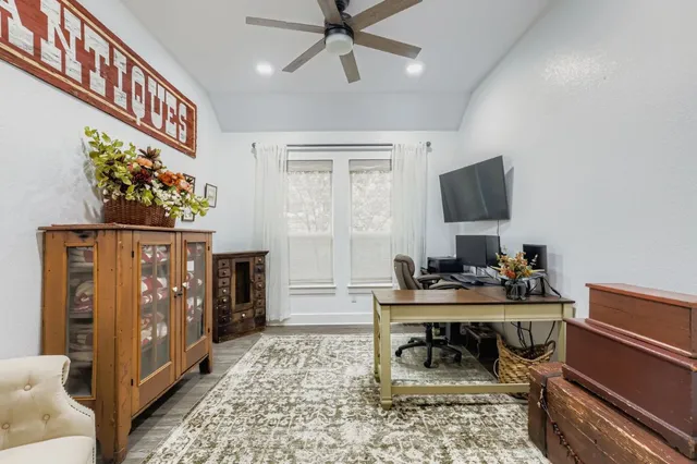 a bedroom with bed and a window