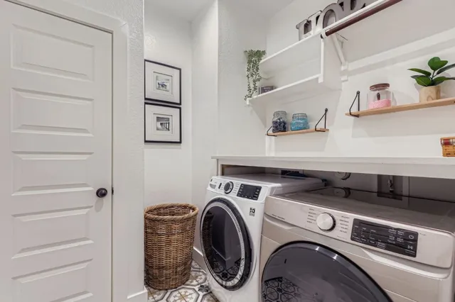 a bathroom with a toilet sink vanity and mirror