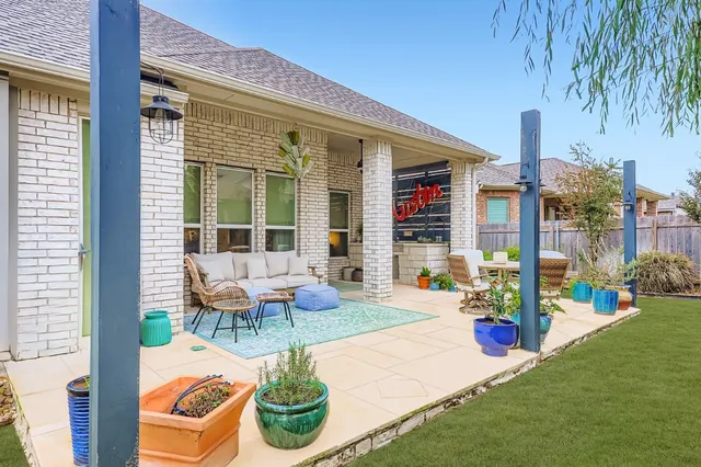 a view of a backyard with swimming pool