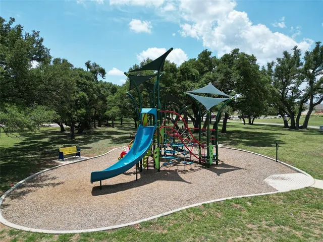 an aerial view of a house with outdoor space swimming pool and lake view
