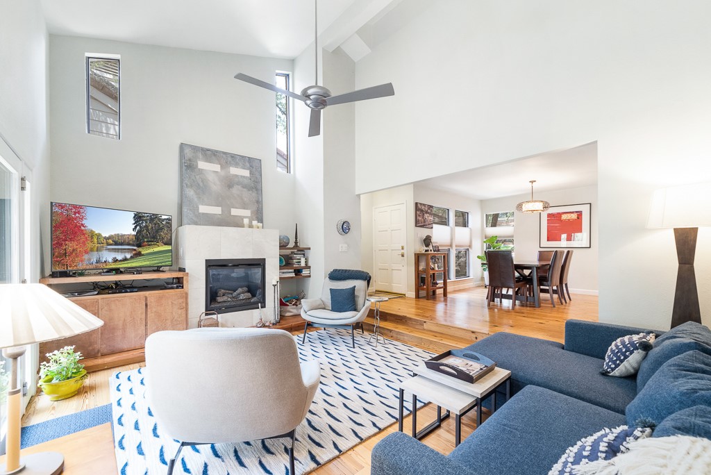 a living room with furniture and a fireplace