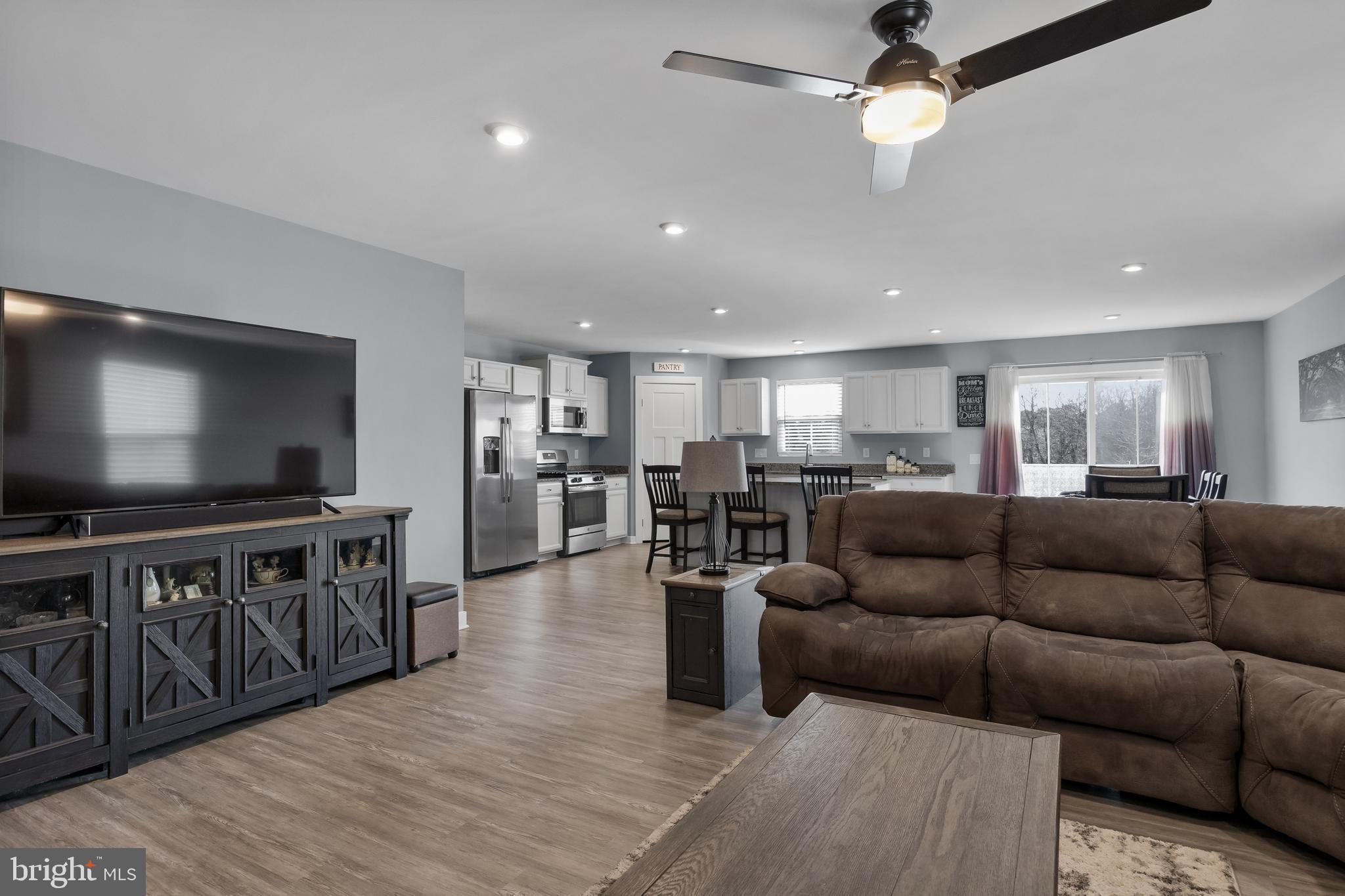 66 Senators Way Berlin, NJ 08009 - Photo 12 of 33 a living room with furniture and a flat screen tv