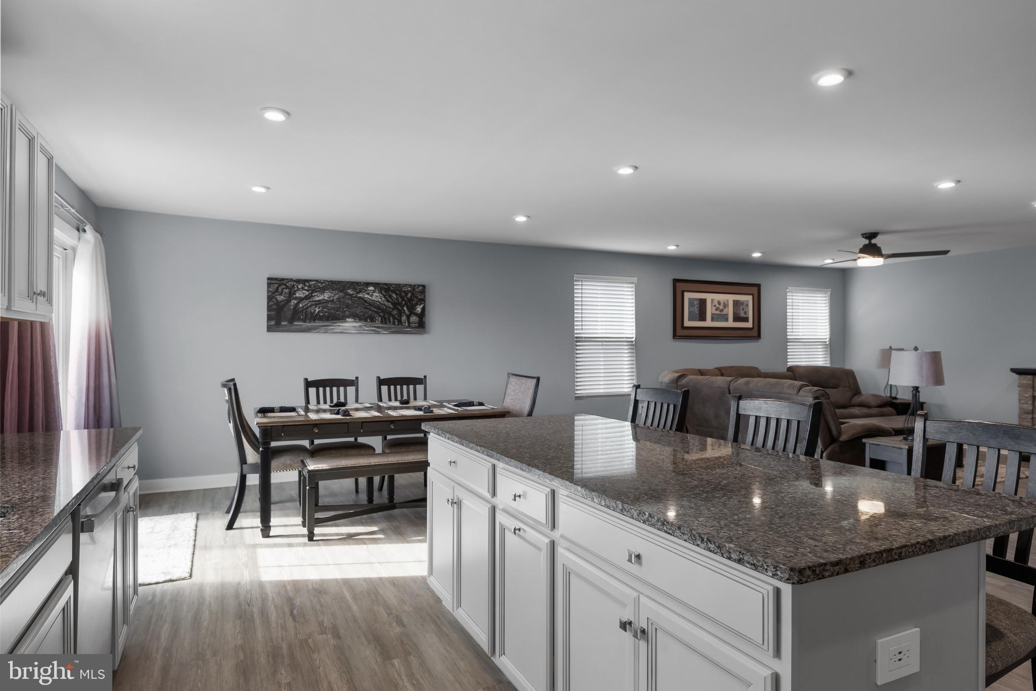 66 Senators Way Berlin, NJ 08009 - Photo 16 of 33 a kitchen with counter space dining table and stainless steel appliances