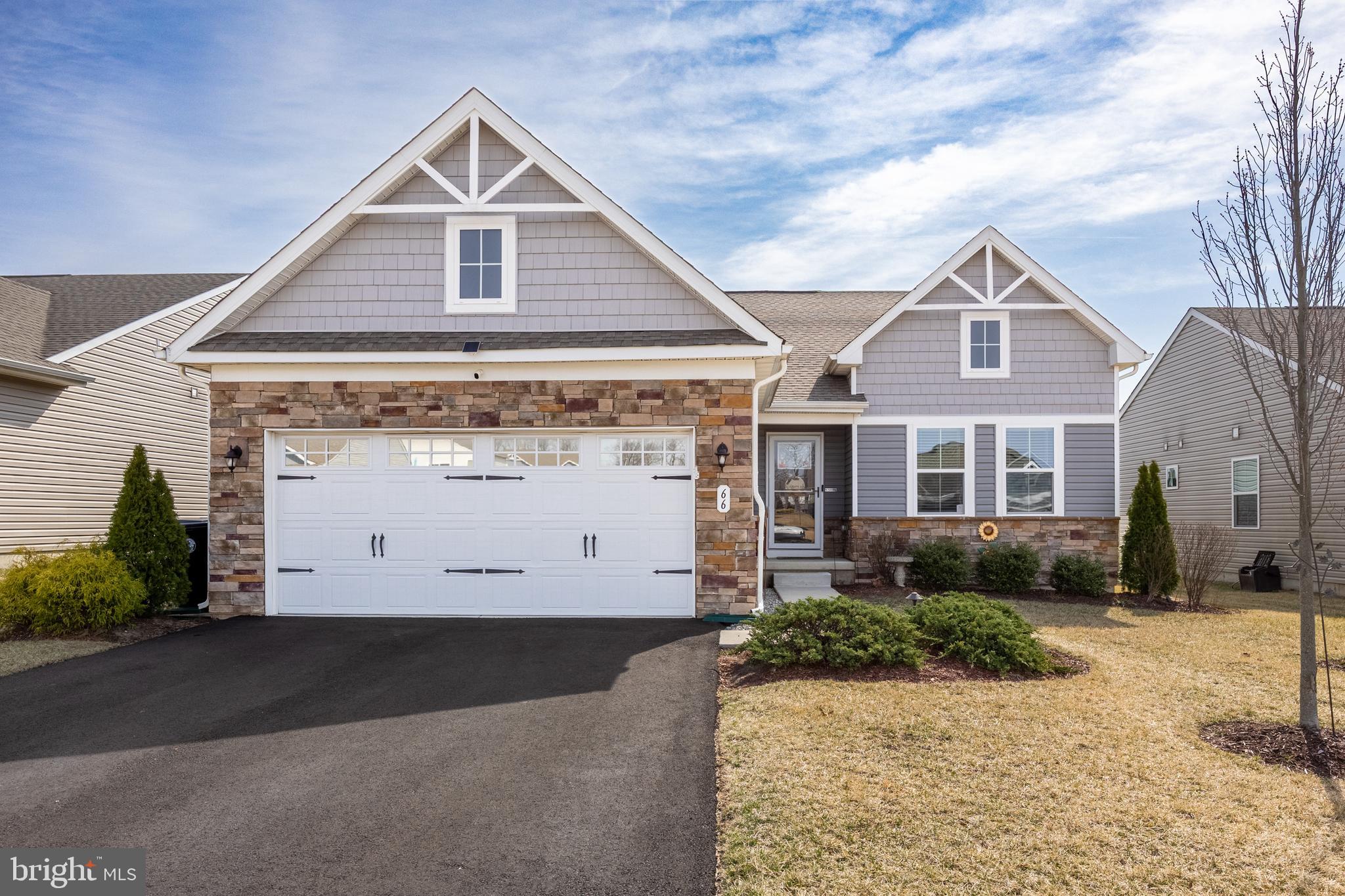 66 Senators Way Berlin, NJ 08009 - Photo 2 of 33 a front view of a house with a yard