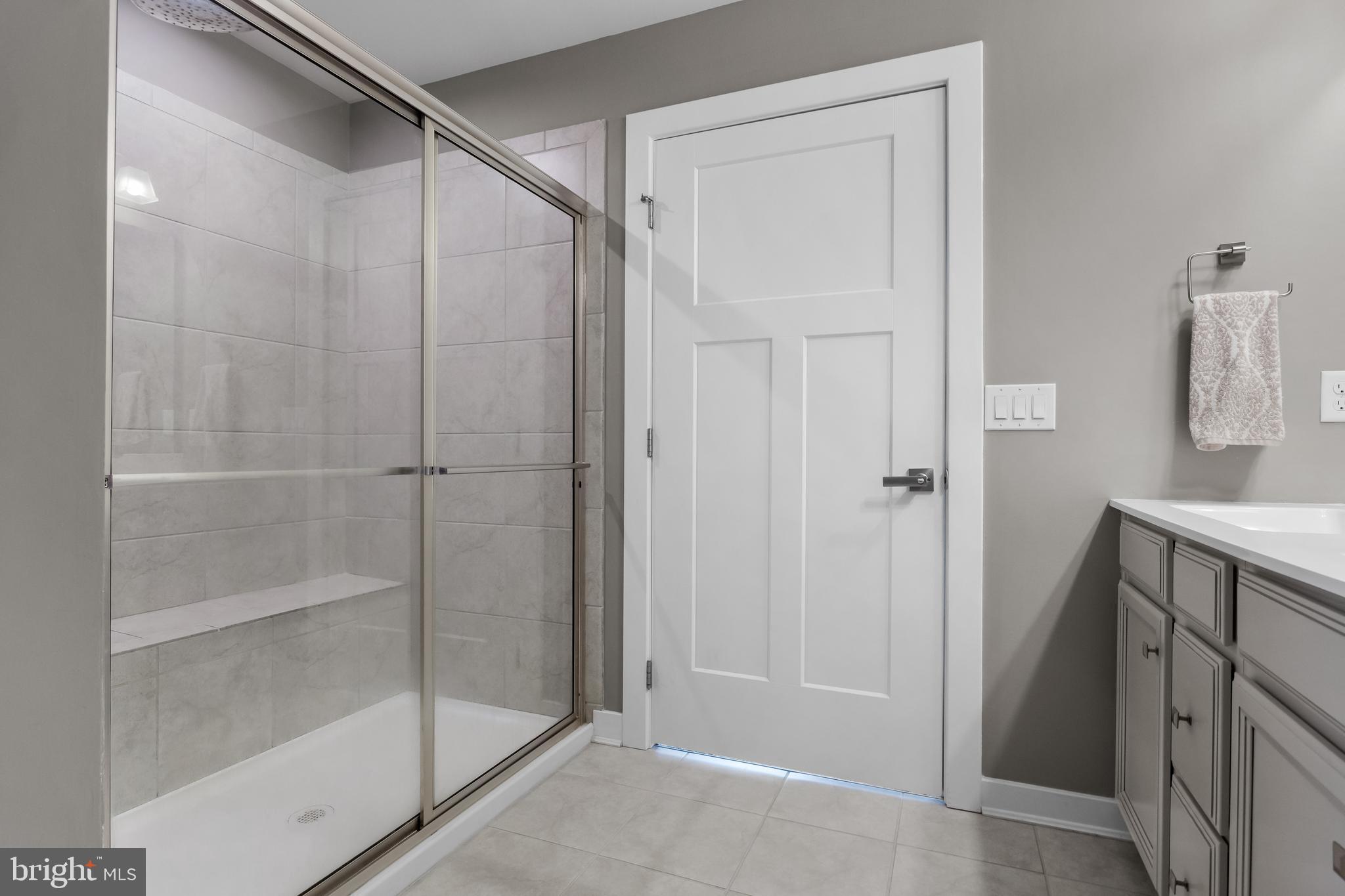 66 Senators Way Berlin, NJ 08009 - Photo 22 of 33 a bathroom with a shower and a sink