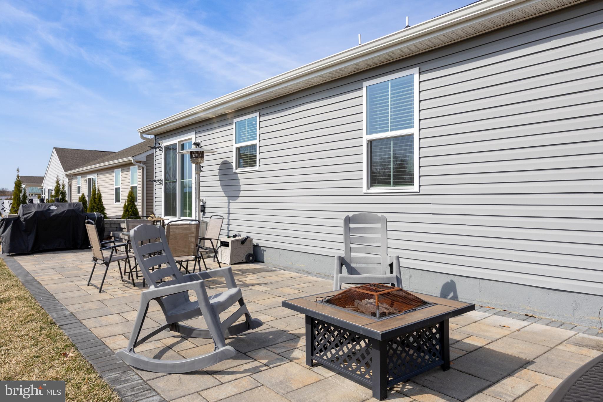 66 Senators Way Berlin, NJ 08009 - Photo 27 of 33 a backyard of a house with table and chairs