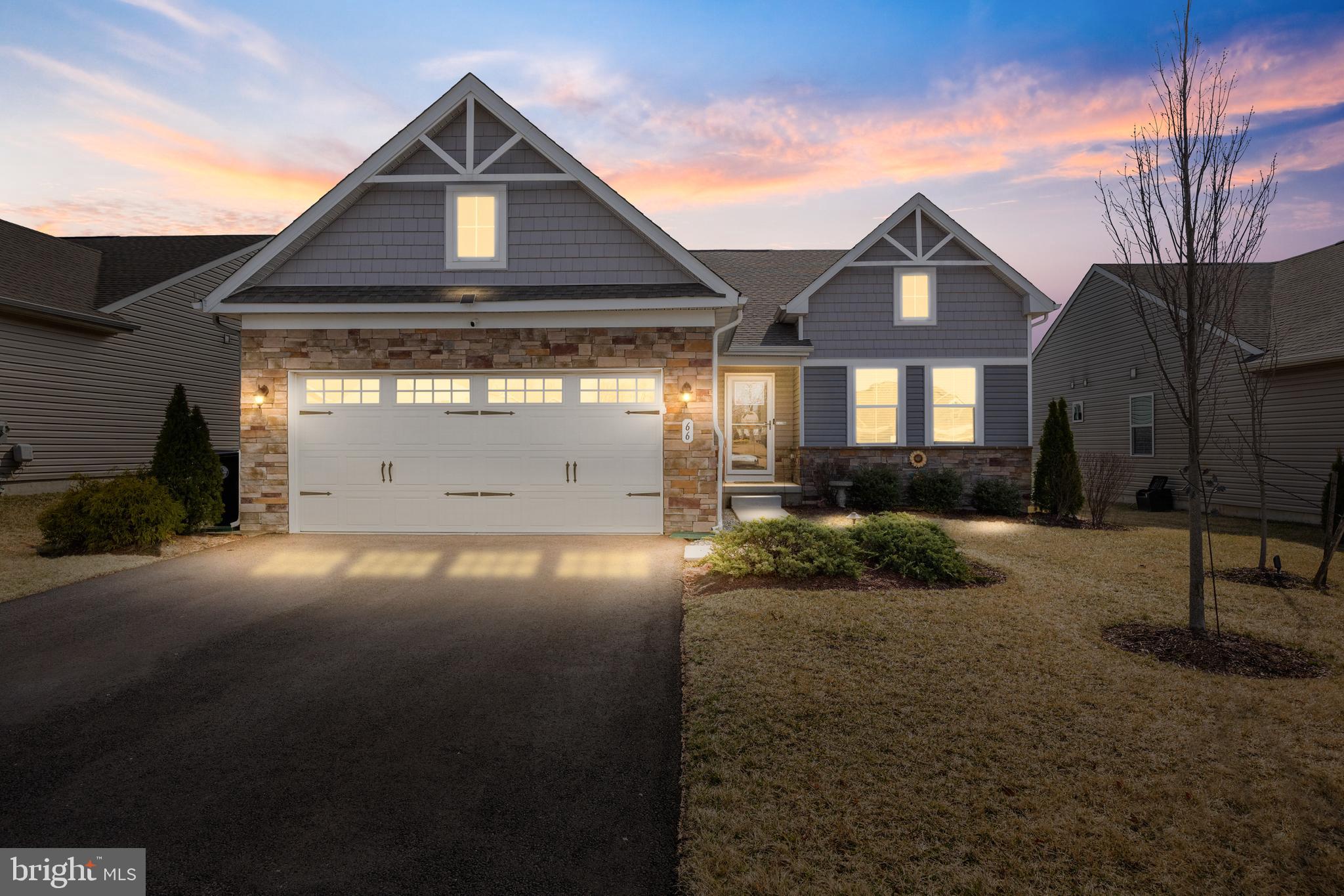 66 Senators Way Berlin, NJ 08009 - Photo 30 of 33 a front view of a house with a yard