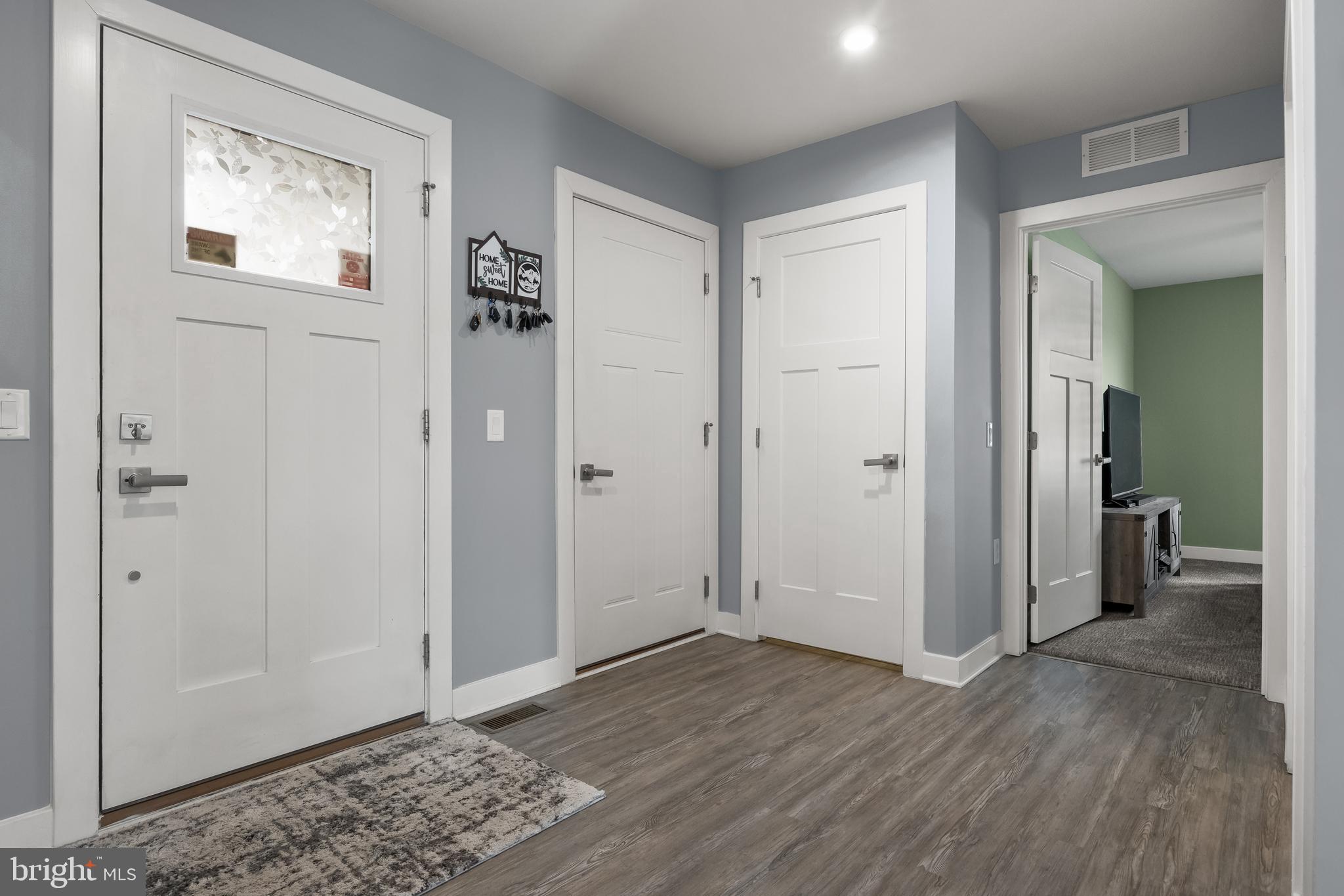 66 Senators Way Berlin, NJ 08009 - Photo 4 of 33 a view of a hallway with wooden floor and closet area