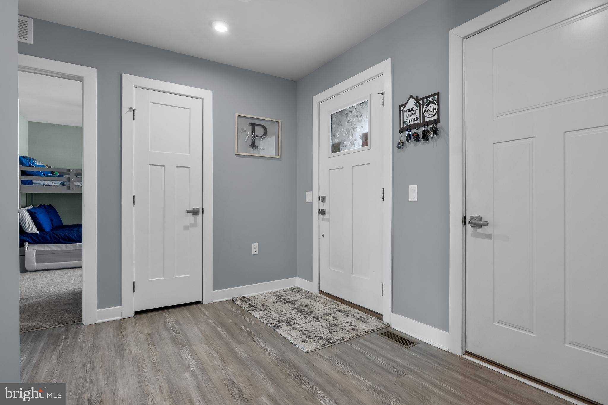 66 Senators Way Berlin, NJ 08009 - Photo 5 of 33 a view of a livingroom with wooden floor and closet