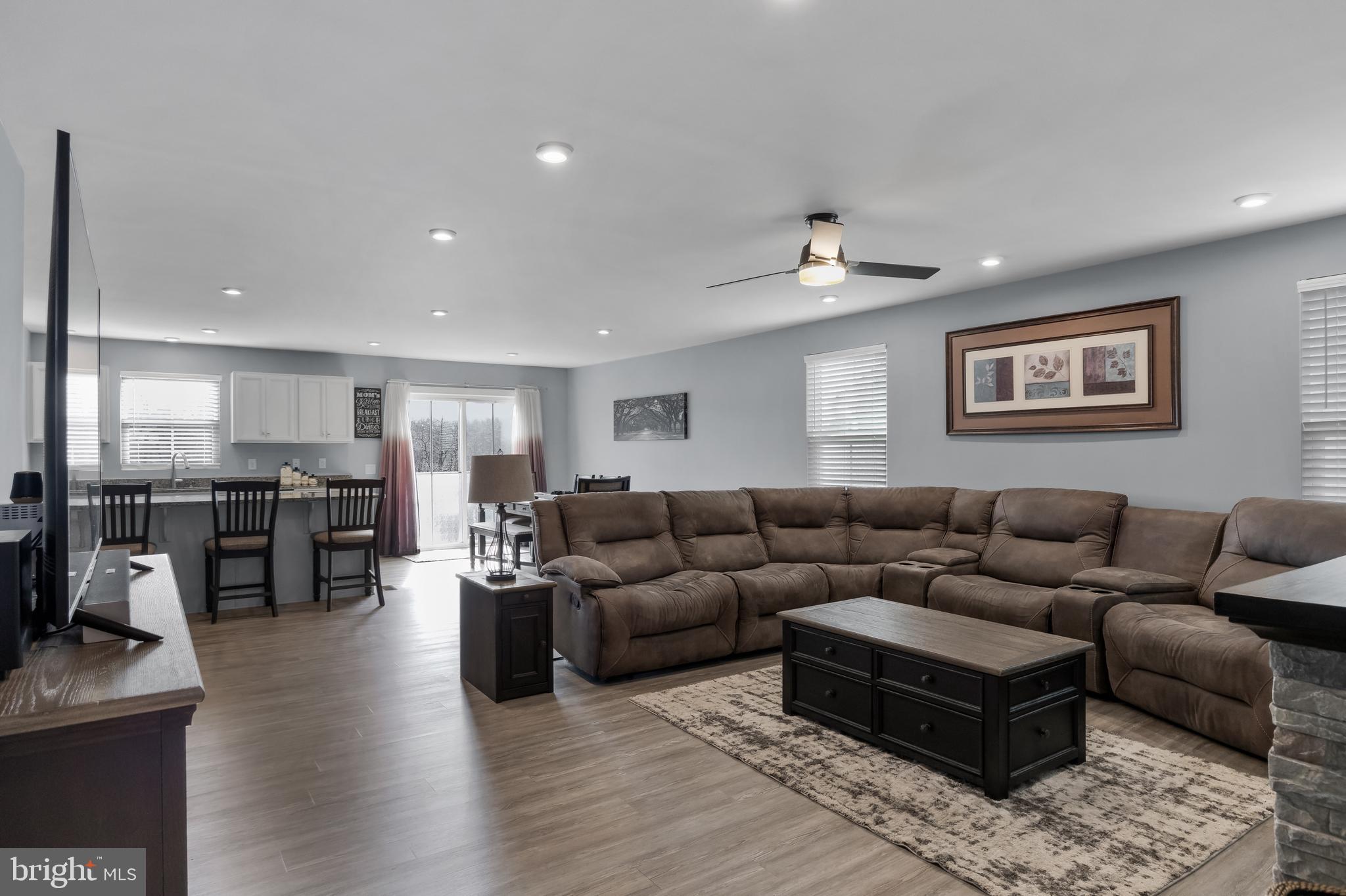 66 Senators Way Berlin, NJ 08009 - Photo 9 of 33 a living room with furniture kitchen view and a chandelier