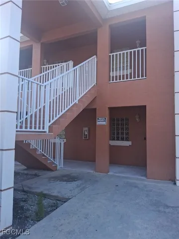 a view of an empty room with stairs