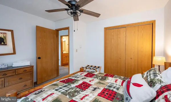 a bedroom with a bed and a dresser