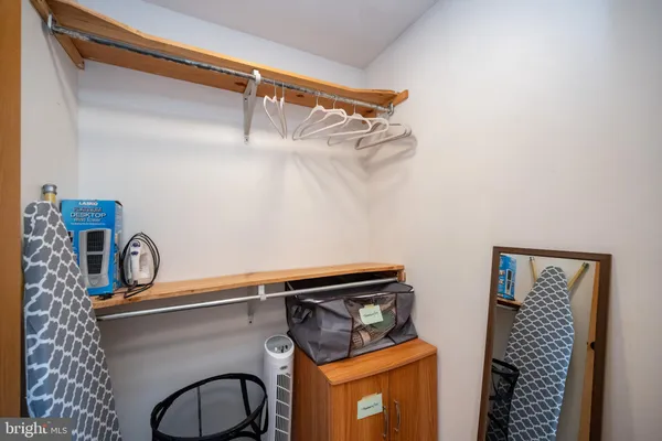 a close view of a utility room with sink dryer and washer