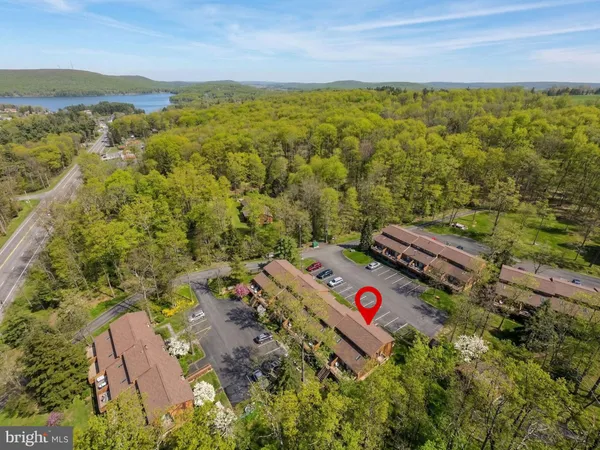 an aerial view of residential houses with outdoor space