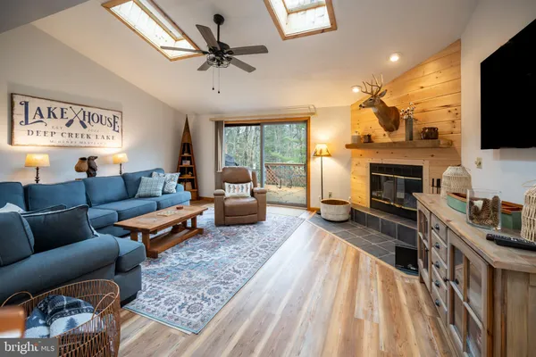 a living room with furniture fireplace and a flat screen tv
