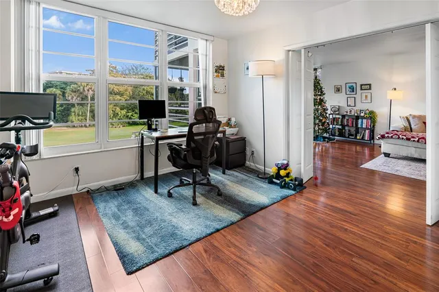a view of a workspace with furniture and a living room