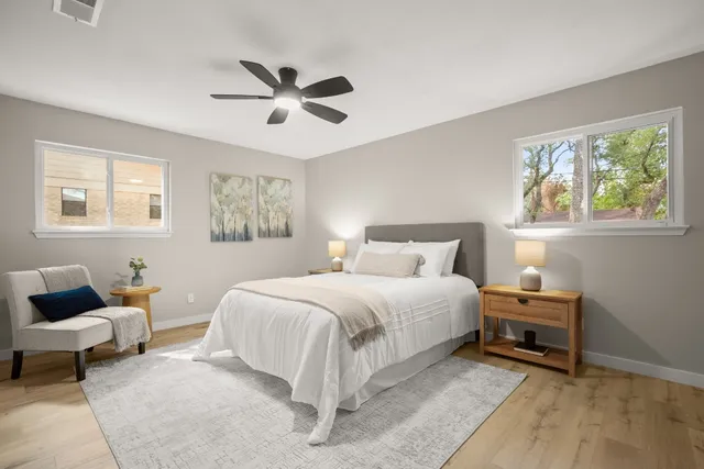 a bedroom with a bed and a window