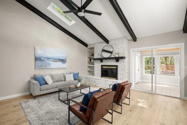 a living room with furniture and a fireplace