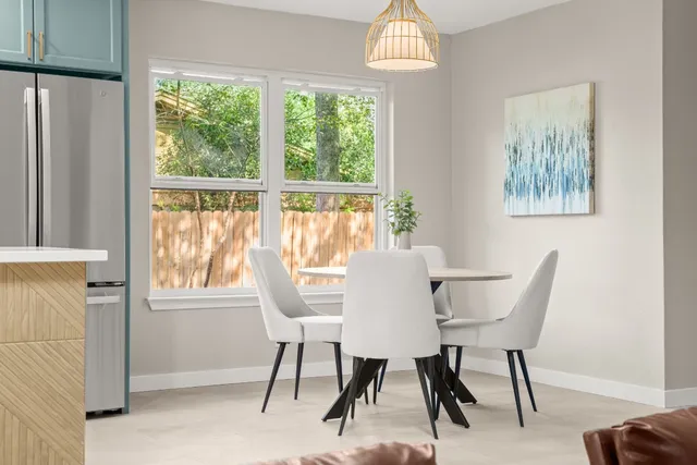 a view of a dining room with furniture window and outside view
