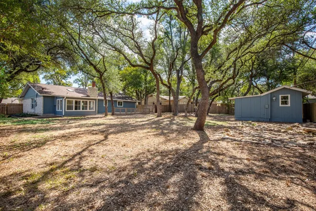 a house with trees in front of it