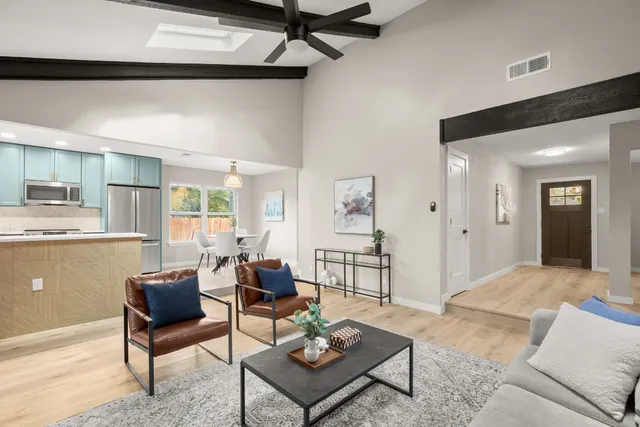 a living room with furniture and a table