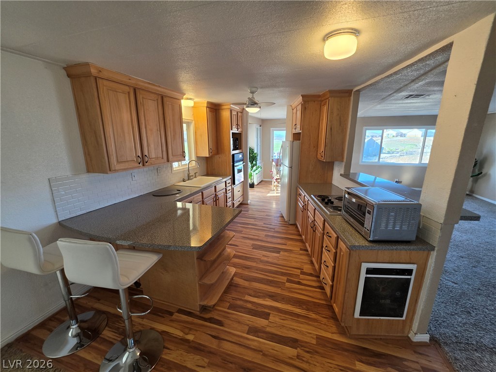 2930 Frehner Ranch Road Pioche, NV 89043 - Photo 7 of 32 A streamlined kitchen design with warm cabinetry and abundant counter space awaits culinary creativity.