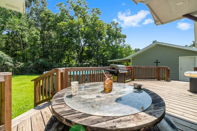 swimming pool view with a seating space